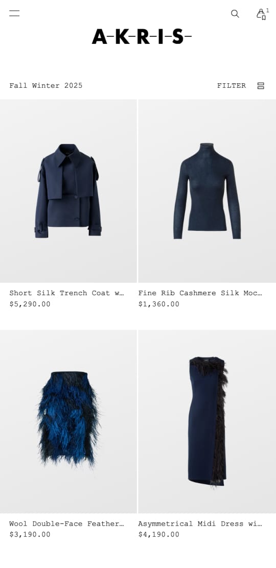Fashion website displaying four items: a short silk trench coat, fine rib cashmere mock neck, wool feather skirt, and asymmetrical midi dress.