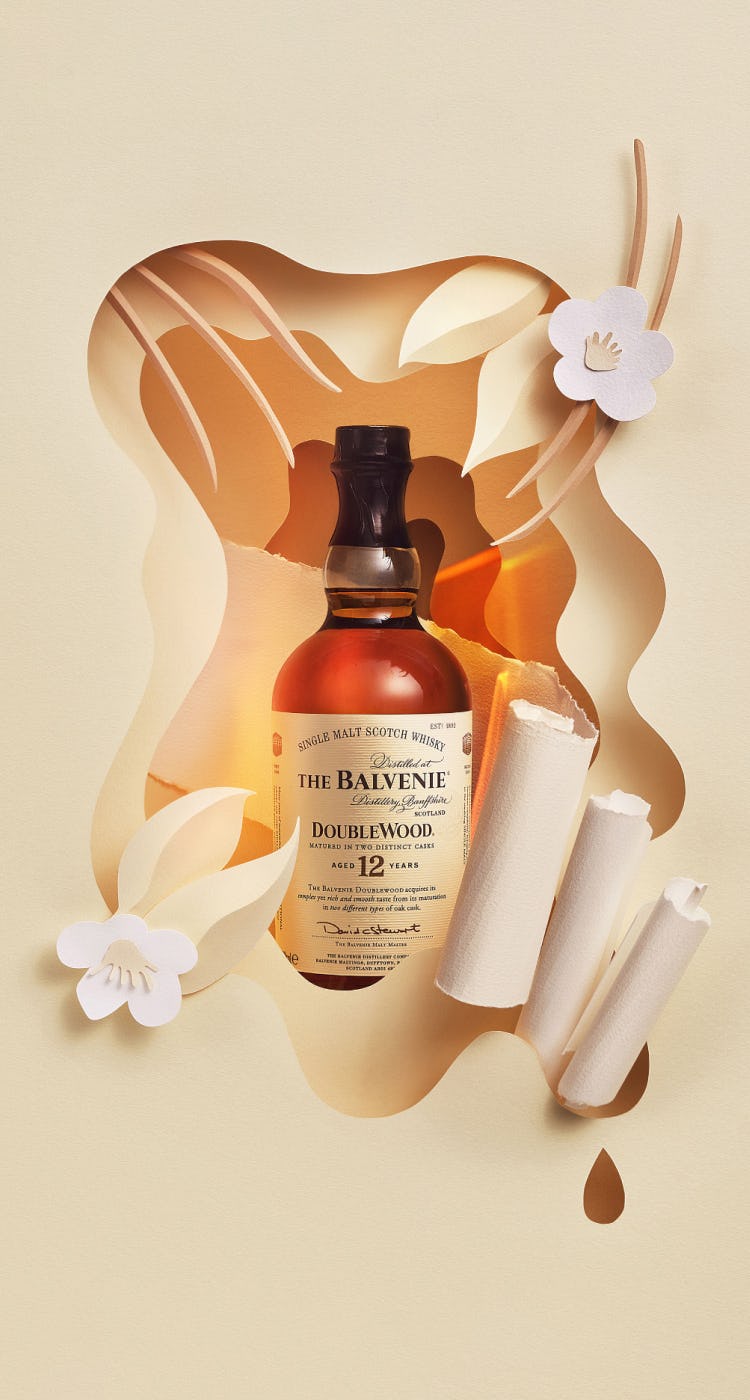 The Balvenie DoubleWood 12 bottle displayed in a paper artwork